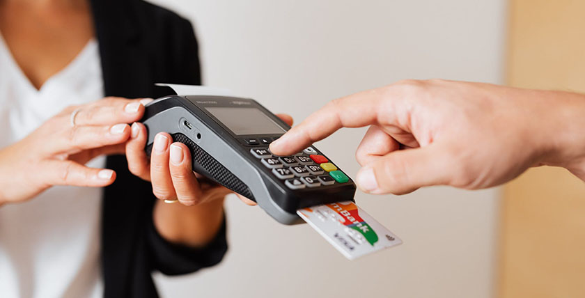 Customer using credit card machine