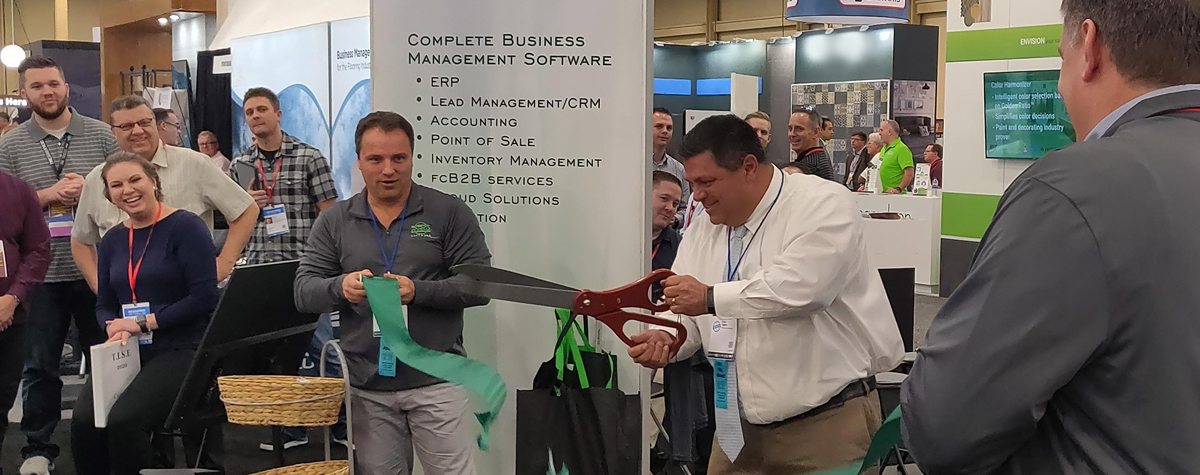 Chad Ogden cuts the ribbon for QPro Software