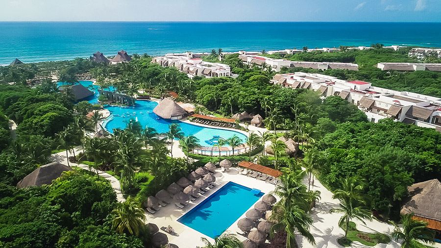 sunny resort with view of ocean in background