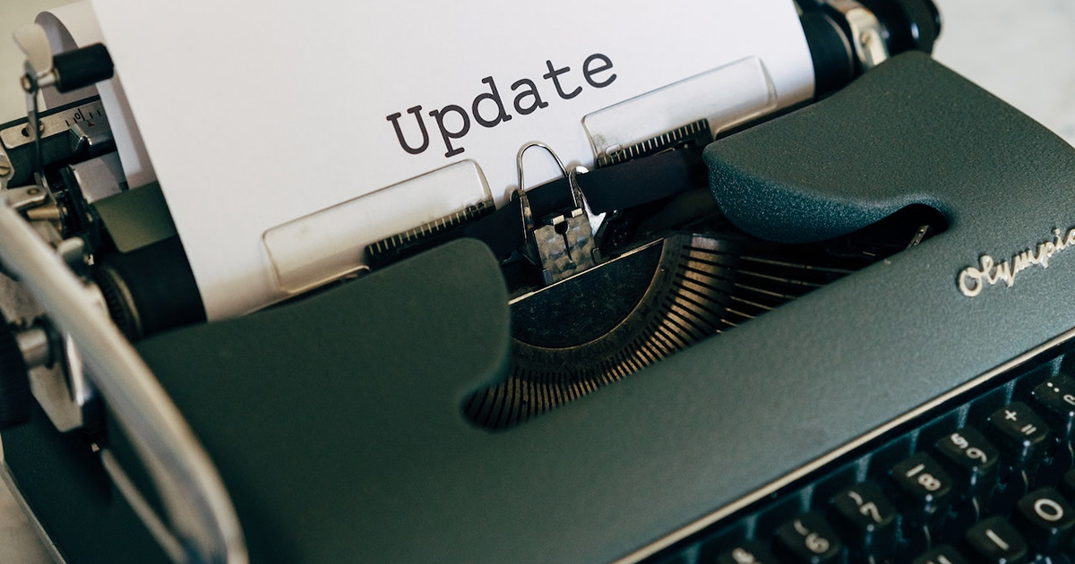 typewriter with text printed saying update