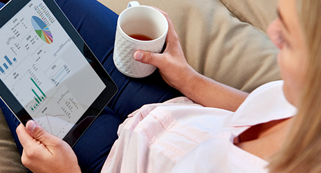 Woman uses QFloors products from a tablet